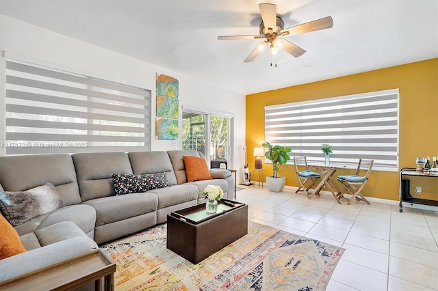 tiled living room featuring ceiling fan