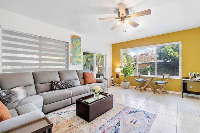 tiled living room featuring ceiling fan