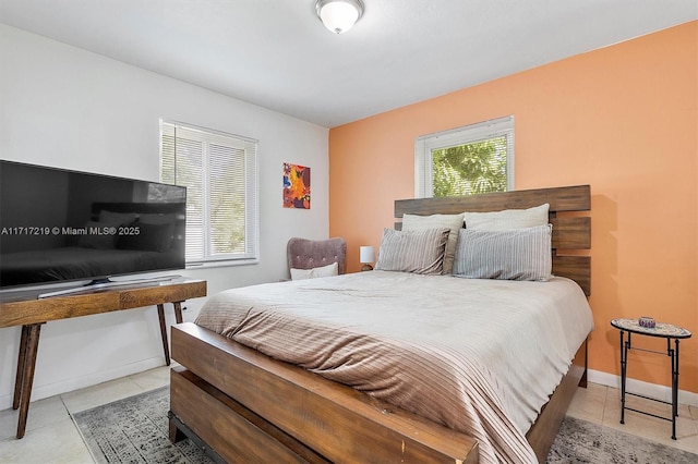 bedroom with light tile patterned flooring