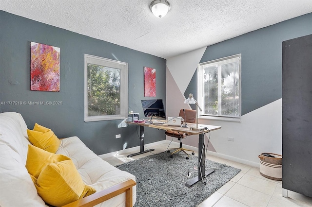 office featuring light tile patterned floors and a textured ceiling