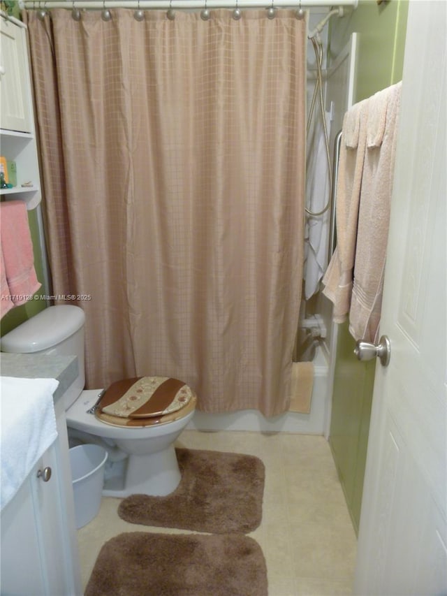 full bathroom featuring vanity, toilet, and shower / bathtub combination with curtain