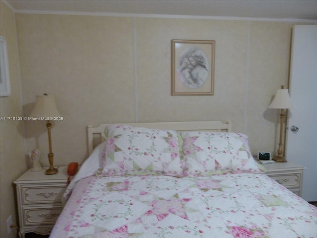 bedroom featuring crown molding