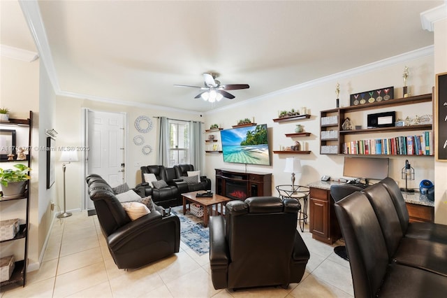 living room with a fireplace, light tile patterned floors, ceiling fan, and crown molding