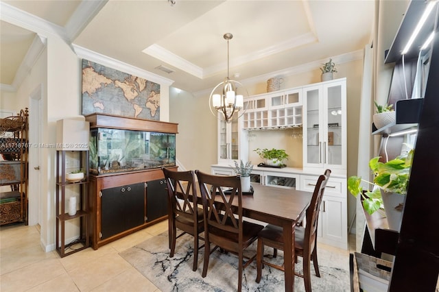 dining area featuring a raised ceiling, crown molding, light tile patterned floors, and a notable chandelier