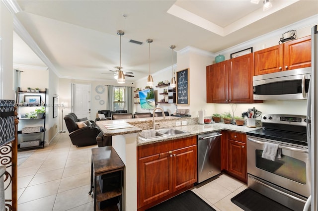 kitchen featuring light stone countertops, sink, kitchen peninsula, light tile patterned floors, and appliances with stainless steel finishes