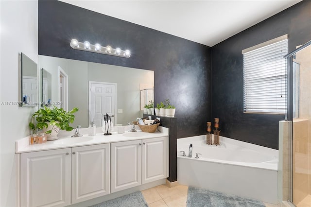 bathroom featuring plus walk in shower, tile patterned flooring, and vanity