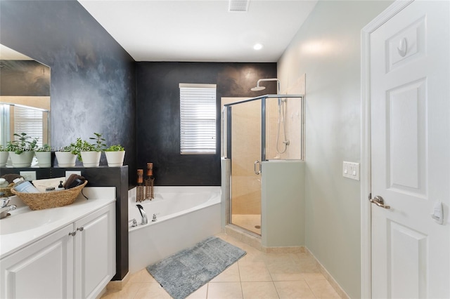 bathroom featuring tile patterned floors, vanity, and independent shower and bath