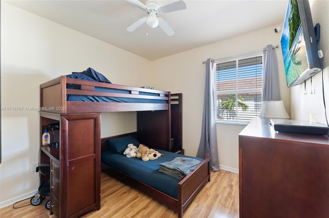 bedroom with light wood-type flooring and ceiling fan