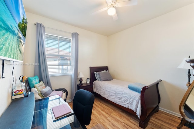 bedroom featuring ceiling fan and wood-type flooring