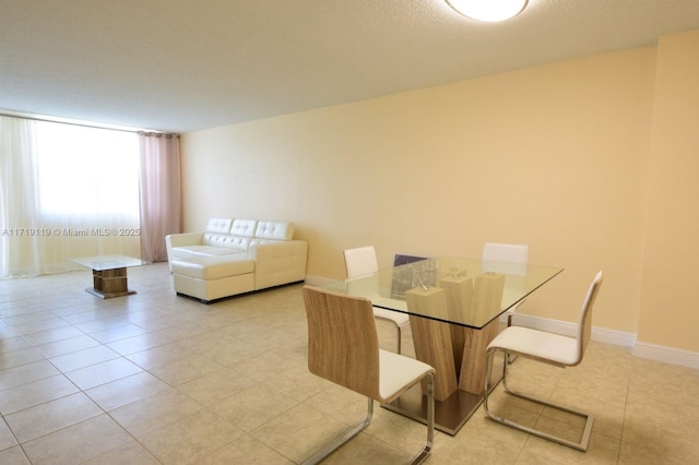 dining room featuring light tile patterned floors