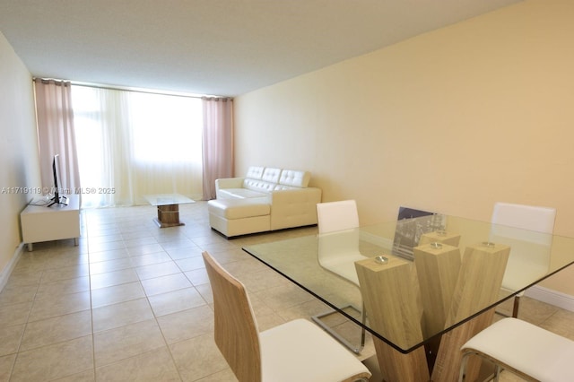 dining area featuring light tile patterned floors