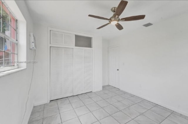 unfurnished bedroom featuring a closet and ceiling fan