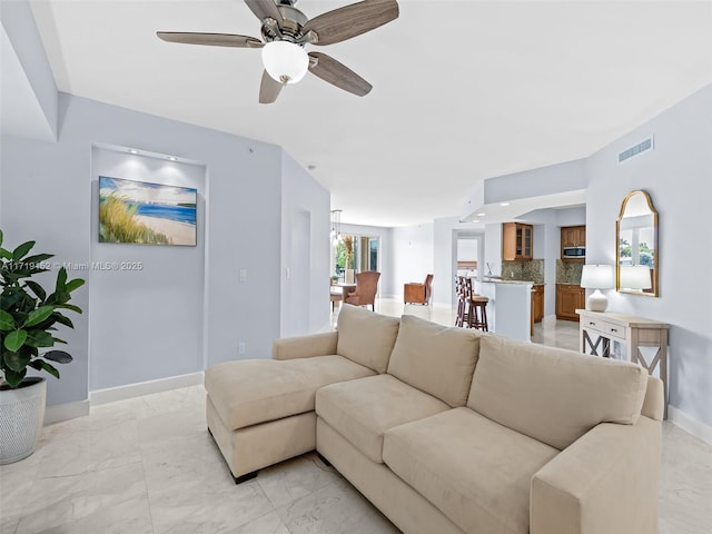 living room featuring ceiling fan