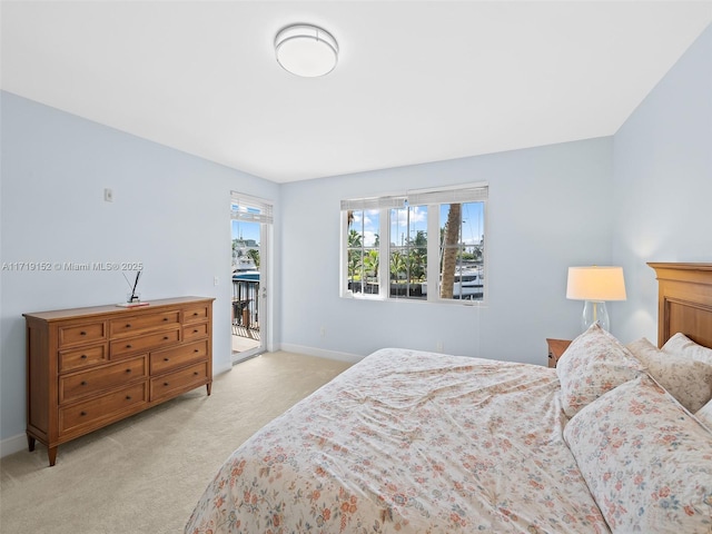 bedroom featuring light carpet