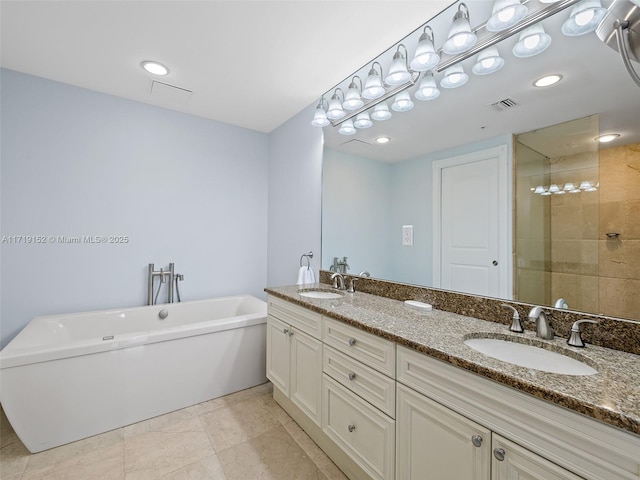 bathroom with separate shower and tub and vanity