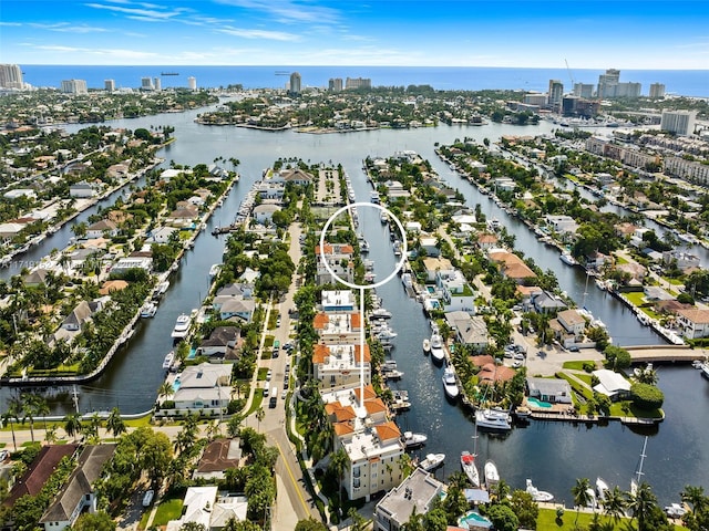 birds eye view of property featuring a water view