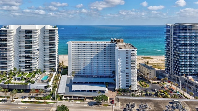 aerial view with a water view and a view of the beach