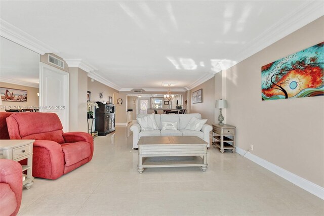 living room with crown molding and a notable chandelier