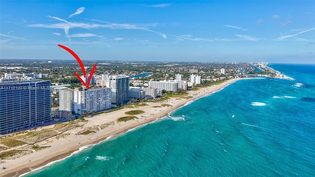 aerial view featuring a water view and a beach view