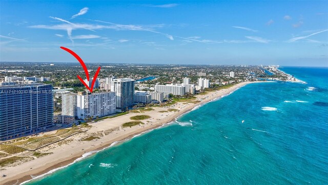 birds eye view of property with a view of the beach and a water view