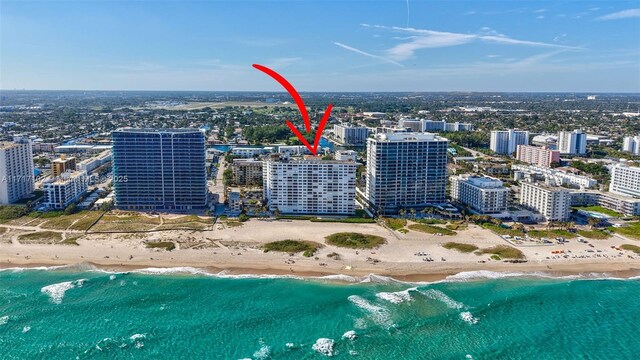 aerial view featuring a beach view and a water view