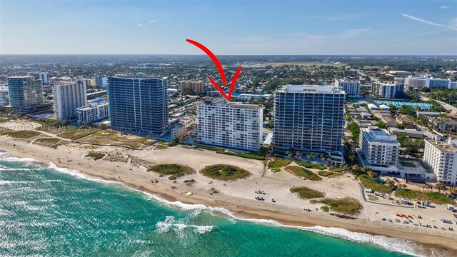 bird's eye view with a view of the beach and a water view