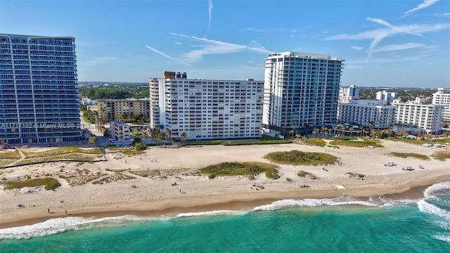 aerial view featuring a water view and a beach view