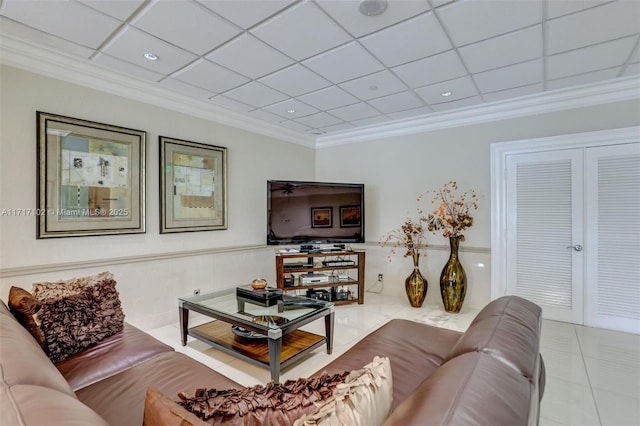 living room featuring a paneled ceiling, light tile patterned flooring, and crown molding