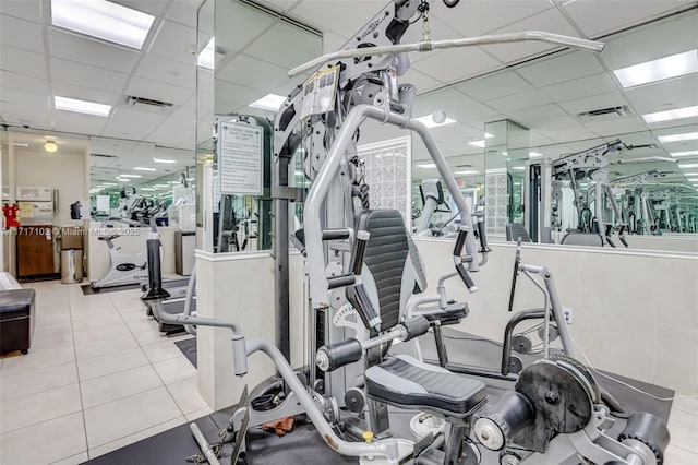 workout area with a paneled ceiling