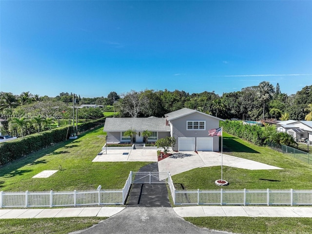 view of front of home featuring a front yard and a garage