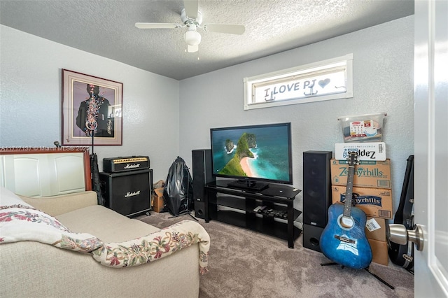 interior space with ceiling fan, light colored carpet, and a textured ceiling