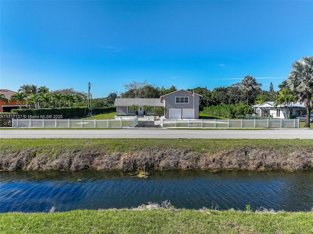 back of house featuring a water view