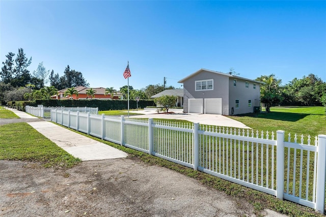 exterior space featuring a garage and a front yard