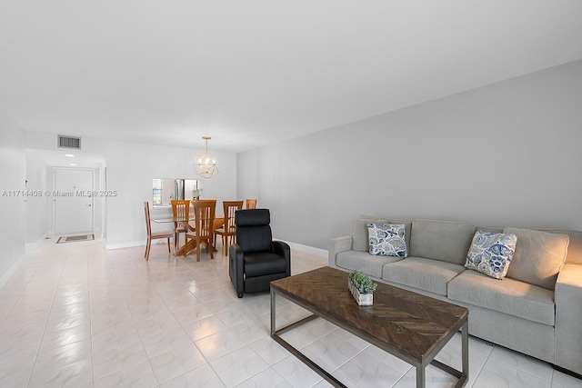 living room featuring a notable chandelier