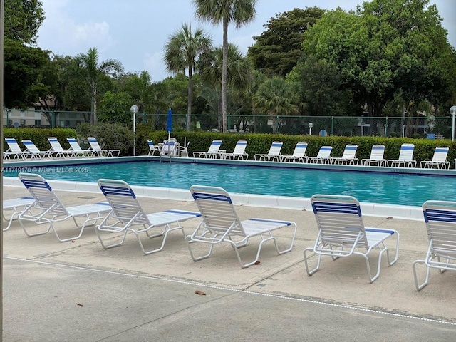 view of swimming pool with a patio area