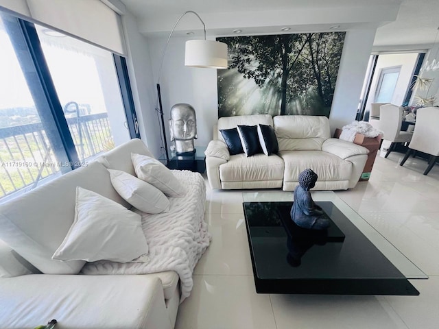 living room with a wealth of natural light and tile patterned flooring