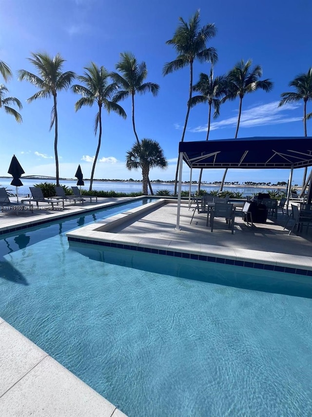 view of swimming pool featuring a patio area