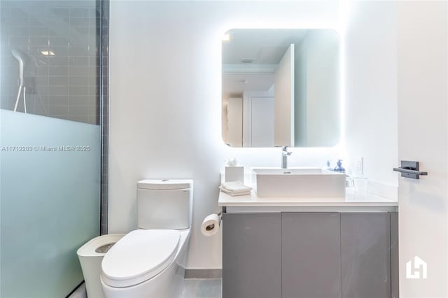 bathroom featuring vanity and toilet