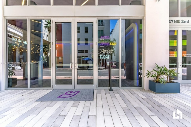 property entrance featuring french doors and a wooden deck