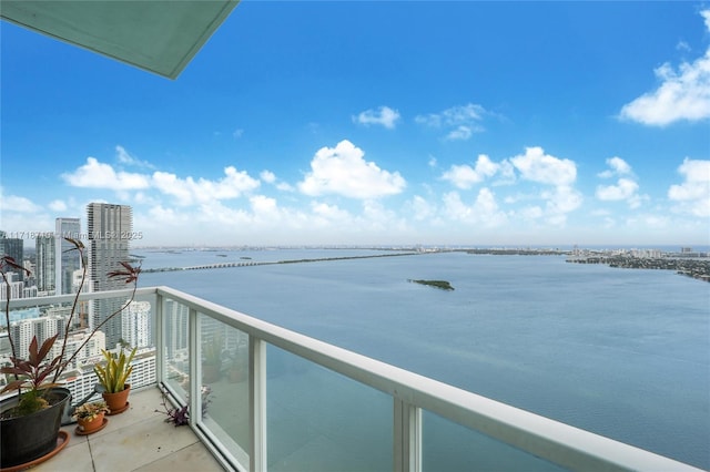 balcony featuring a water view