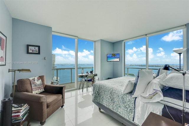 tiled bedroom with expansive windows