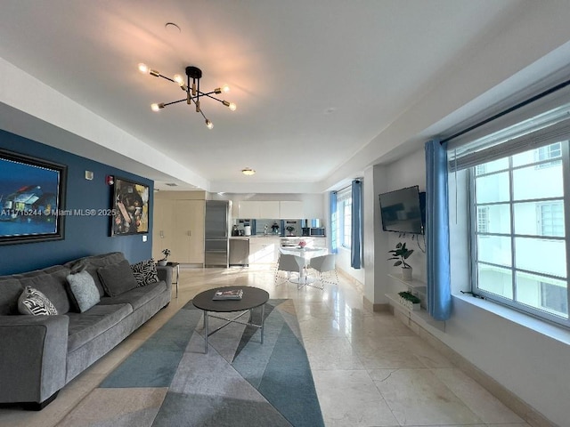 living room featuring a notable chandelier