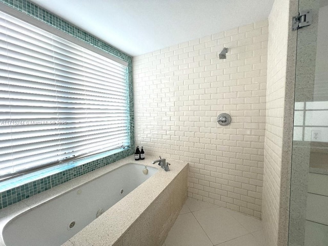 bathroom with tile patterned floors and independent shower and bath