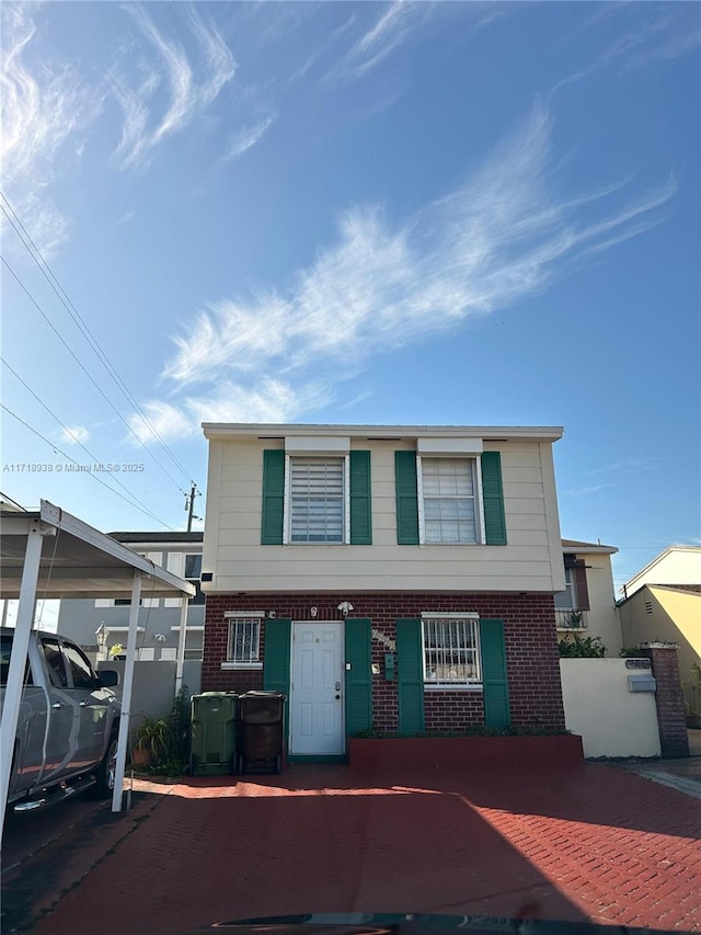 view of front of property with a carport