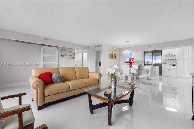 living room with light tile patterned flooring