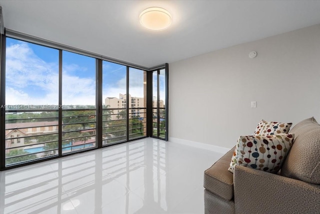 sitting room featuring floor to ceiling windows