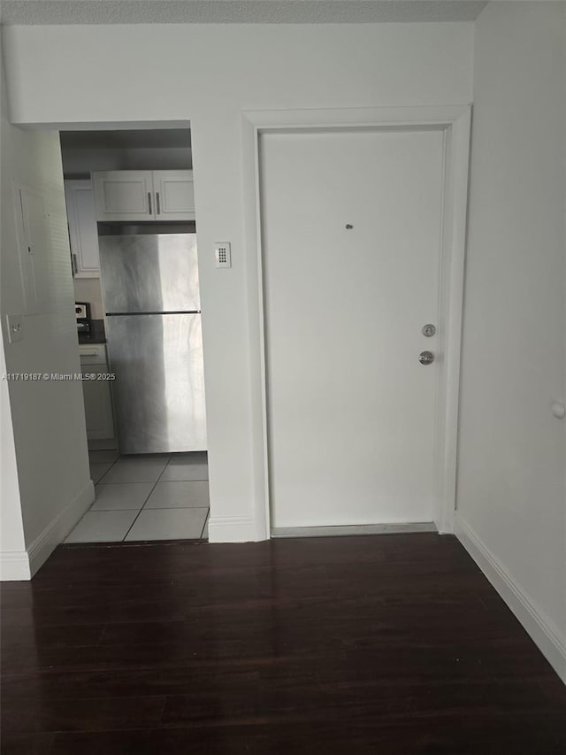 hallway with dark wood-type flooring