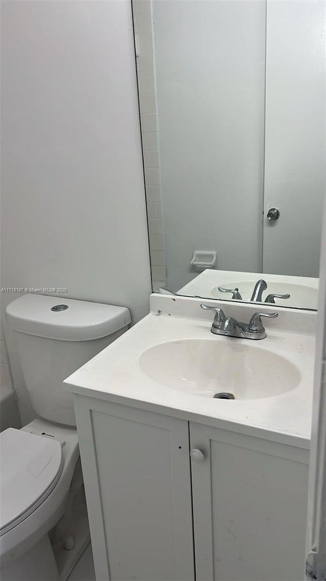 bathroom featuring vanity and toilet