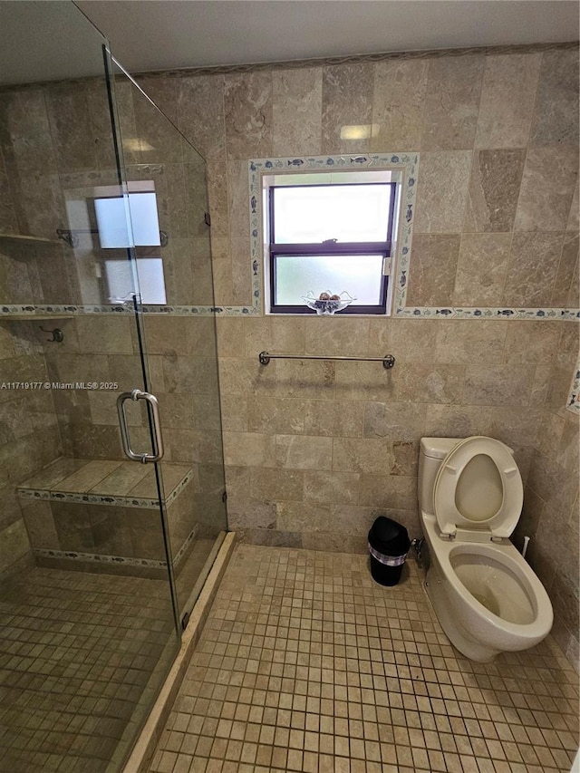 bathroom with toilet and walk in shower