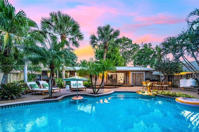 view of patio with outdoor lounge area, a gazebo, and a swimming pool